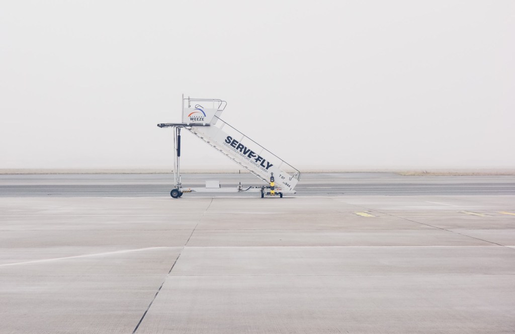 From https://www.wallpaperflare.com/white-airliner-stairs-on-runway-white-airplane-portable-stairs-during-daytime-wallpaper-wjylz